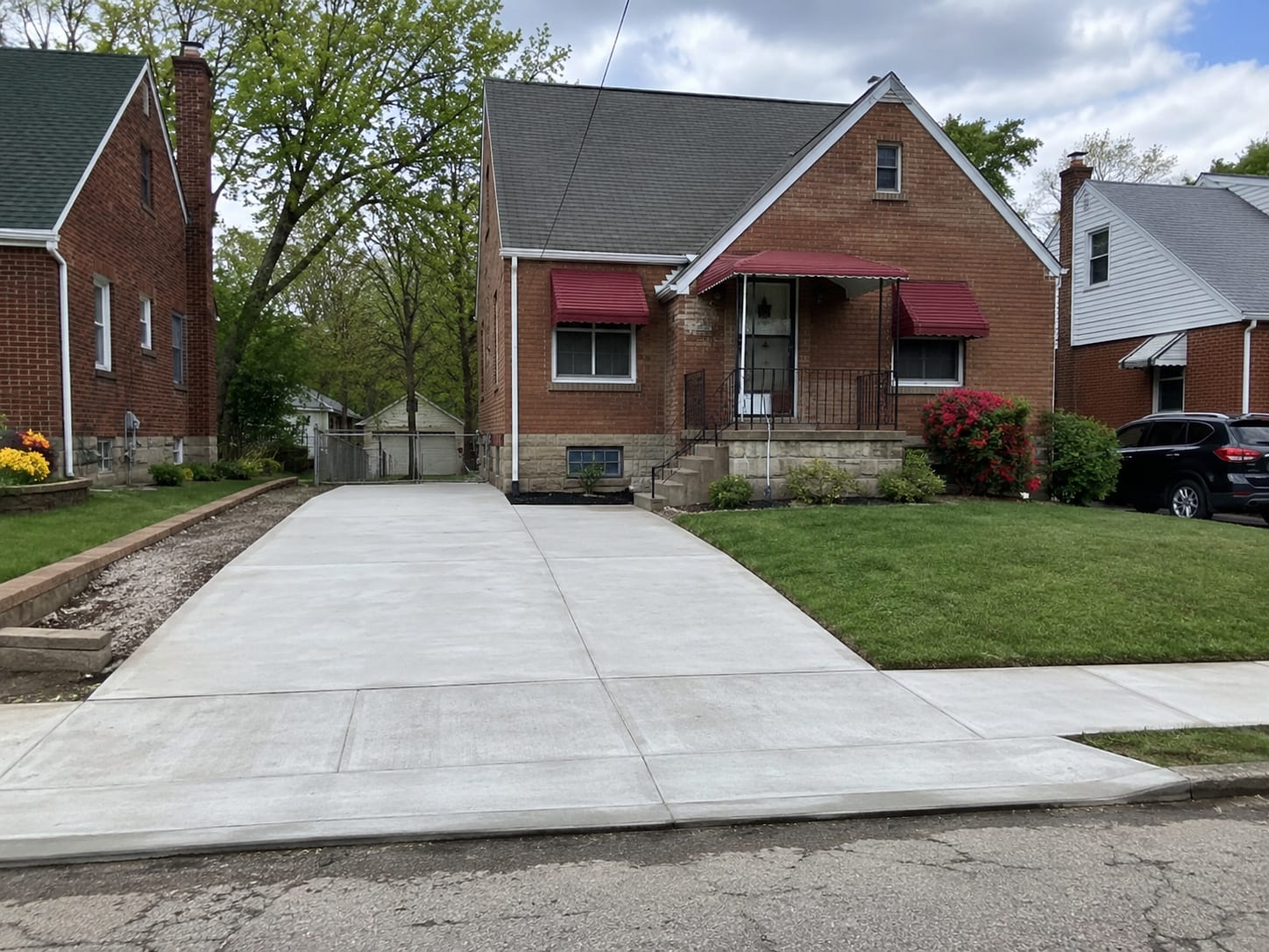 Stamped concrete driveway with a patterned, stone-look finish in Pittsburgh