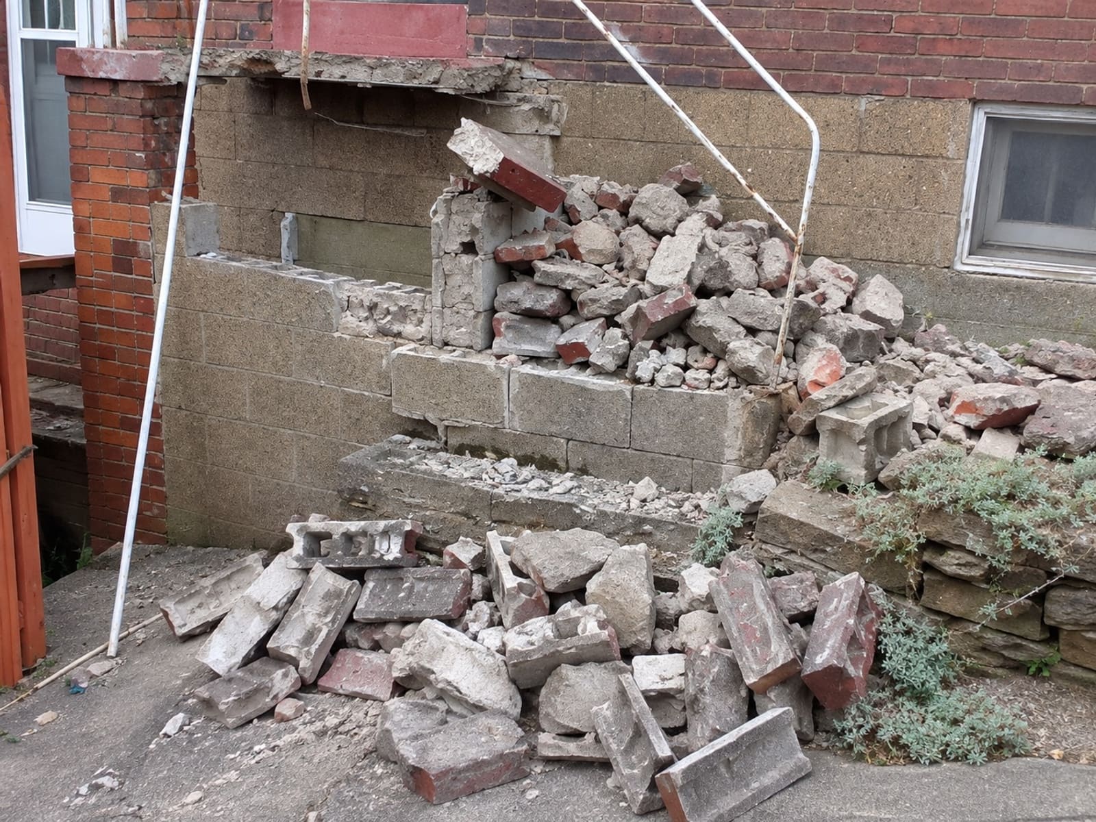 Concrete and masonry rubble from a demolished stair and wall ready for haul-away in Pittsburgh