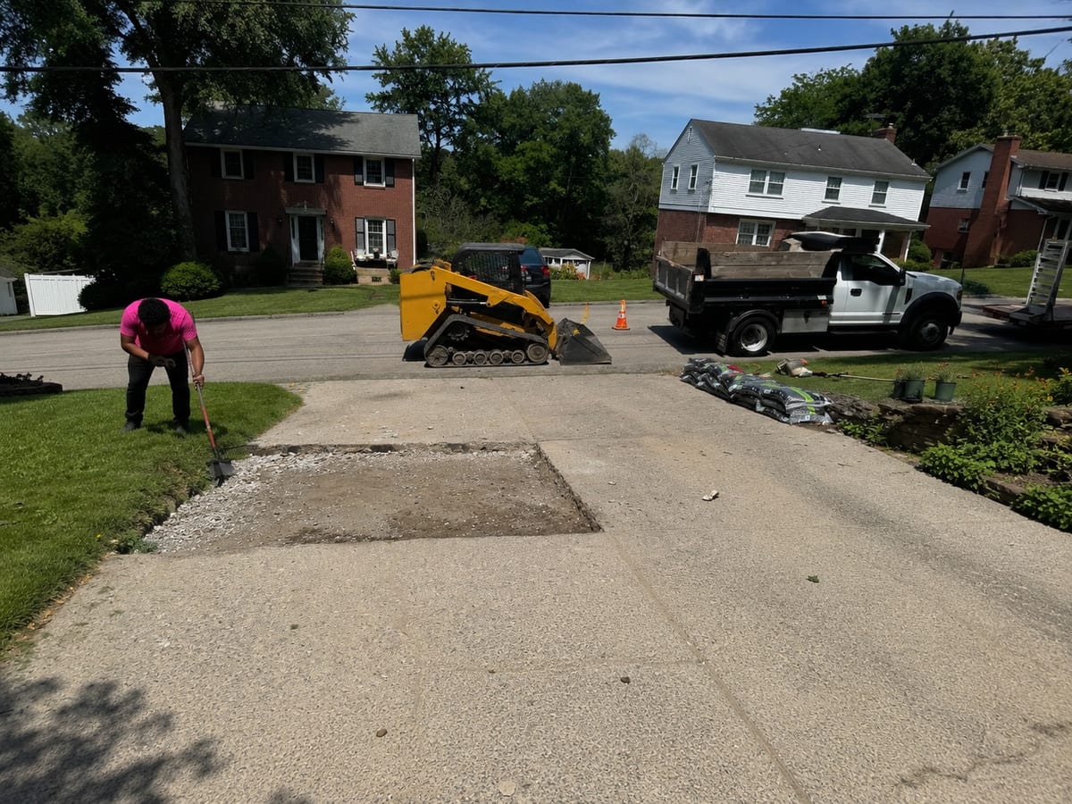 Sectional driveway repair in progress on a Pittsburgh concrete driveway