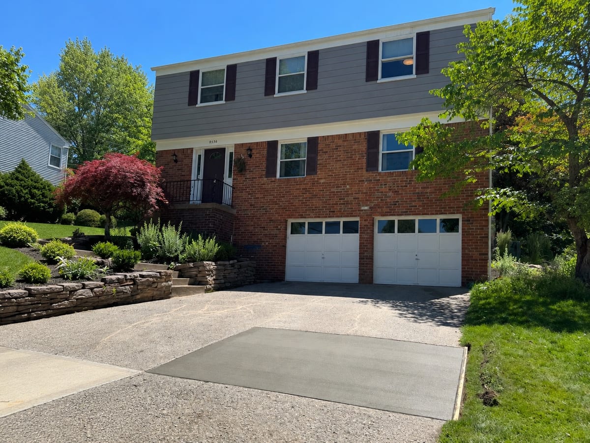 Finished broom-finish concrete driveway and apron at a Pittsburgh home
